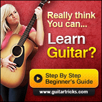 lady learning guitar